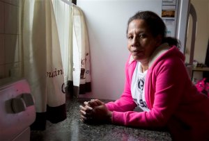 In this photo taken March 24, 2016, Sharon Johnson poses in her apartment in Lynn, Mass.  Johnson calls herself an addict, although shes been sober for three years now. She started by smoking pot and eventually moved to crack cocaine. Her daughter has tried heroin and I believe Im going to pull her out of the gutter someday, she laments.  (AP Photo/Michael Dwyer)
