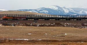 In this Nov. 7, 2013 file photo, a train hauls oil into Glacier National Park near the Badger-Two Medicine National Forest in northwest Montana. The Obama administration on Thursday, March 17, 2016, canceled a disputed oil and gas lease just outside Glacier National Park that is on land considered sacred to the Blackfoot tribes of the U.S. (AP Photo/Matthew Brown, File)
