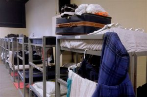 Beds are folded and clothes are stacked by residents at Helping Hands of Springfield homeless shelter, Tuesday, March 22, 2016 in Springfield, Ill. Illinois homeless shelters would get much-needed financial help during the state's budget stalemate under a proposal to send them proceeds from a newly created lottery scratch ticket. The states budget for the current year shouldve taken effect July 1. (AP Photo/Seth Perlman)