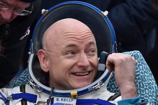 NASA spaceman back from record year flight; gives thumbs&nbsp;up