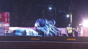 In this image made from video, emergency workers stand at the scene of a fatal collision on Interstate 75 in Dayton, Ohio, early Saturday, Feb. 13, 2016. A suspected drunken driver going the wrong way slammed head-on into an SUV, killing himself and four people inside the other vehicle, police said. (WHIO-TV Dayton via AP)