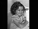 FILE - This Sept. 10, 1935 file photo shows actress Shirley Temple in Los Angeles. A blue diamond ring that child star-turned-diplomat Shirley Temple wore for decades is going up for auction. Sothebys says the 9.54 carat ring is among the more than 300 lots in the Magnificent Jewels auction scheduled for April 19, 2016, in New York. It has a pre-sale estimate of between $25 million and $35 million. (AP Photo/Marty Lederhandler, File)