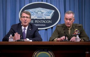 Defense Secretary Ash Carter, accompanied by Joint Chiefs Chairman Gen. Joseph Dunford, speaks during a news conference at the Pentagon, Friday, March 25, 2016, where they announced U.S. forces killed a senior Islamic State leader, among several key members of the militant group eliminated this week. (AP Photo/Mauel Balce Ceneta)