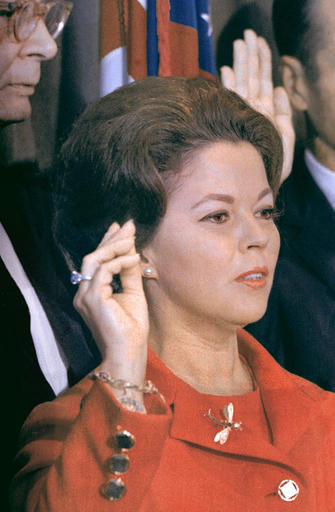 FILE - In this Sept. 16, 1969 file photo, Shirley Temple Black raises her hand at the United Nations as she is sworn in as a U.N. delegate. The child star-turned-ambassador was given the 9.54 carat blue diamond ring she is wearing in the photo by her father for her 12th birthday, and it is now going up for auction on April 19, 2016 by Sotheby's in New York. The ring, purchased in 1940 for $7,210, now has a pre-sale estimate of between $25 million and $35 million. (AP Photo, File)