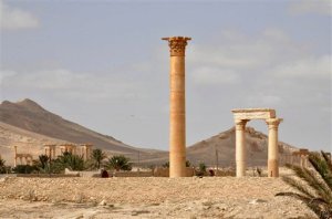 This photo released on Sunday March 27, 2016, by the Syrian official news agency SANA, shows a general view of Palmyra, central Syria. Palmyra is an archaeological gem that Syrian troops took back from Islamic State fighters in central Syria. The amount of destruction found inside the archaeological area in the historic Syrian town of Palmyra was similar to what experts have expected but the shock came Monday from inside the local museum where the extremists have caused wide damage demolishing invaluable statues that were torn to pieces. (SANA via AP)