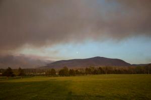 In this Wednesday, April 20, 2016 photo, smoke fills the sky as a forest fire burns in the Shenandoah National Park near Elkton, Va. Crews with the Virginia Department of Forestry worked Wednesday to contain the wildfire. (Michelle Mitchell/News-Virginian via AP)