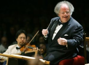 FILE - This July 7, 2006 file photo shows Boston Symphony Orchestra music director James Levine, right, conducting the symphony on its opening night performance at Tanglewood in Lenox., Mass. The Metropolitan Opera said, Thursday, April 14, 2016, that Levine will retire as music director at season's end. (AP Photo/Michael Dwyer, File)