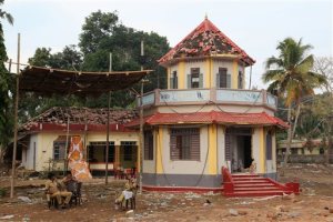 Indian policemen guard the damaged structures at the spot where a massive fire broke out during a fireworks display at the Puttingal temple complex in Paravoor village, Kollam district, southern Kerala state, India, Monday, April 11, 2016. Rescue officials on Monday sifted through a Hindu temple in southern India where at least 110 people died when a fireworks display - an unauthorized pyrotechnic display that went horribly wrong - swept through a temple packed with thousands for a religious festival. (AP Photo/Aijaz Rahi)