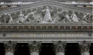 This Thursday, Oct. 2, 2014, file photo, shows the facade of the New York Stock Exchange. Global stock markets were trading largely higher Tuesday, April 26, 2016, as traders digested a raft of corporate earnings statements from around the world in the run-up to the latest policy decisions from the U.S. Federal Reserve and the Bank of Japan. (AP Photo/Richard Drew, File)
