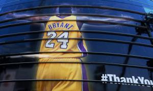 A giant banner congratulating Kobe Bryant is draped around Staples Center before his last NBA basketball game, a contest against the Utah Jazz, in downtown Los Angeles on Wednesday, April 13, 2016. Many of Bryant's fans - even some of the adults - have never known Los Angeles without him. It's a feeling they're about to have to get used to as fans celebrate his final night as a Laker. (AP Photo/Richard Vogel)