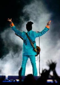 FILE - In this Feb. 4, 2007 file photo, Prince performs during the halftime show at Super Bowl XLI at Dolphin Stadium in Miami. Since Prince died, YouTube and other uploading sites have been flooded with hundreds of hours of the superstar musician's songs, concert footage, TV appearances and music videos. It's a sign that the notoriously tight copyright controls the artist maintained over his material is rapidly loosening, and raising hope that hardcore fans might someday hear the Holy Grail of Prince's music: unreleased recordings from the vault at Paisley Park. (AP Photo/Chris Carlson, File)