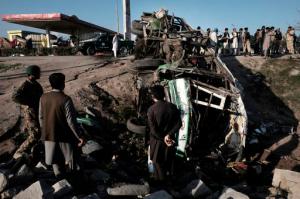 Afghans inspect the damages of a bus after a suicide attack in Jalalabad east of Kabul, Afghanistan, Monday, April 11, 2016. An Afghan official says that at least 12 new army recruits have been killed in a suicide bomb attack in the eastern city of Jalalabad. (AP Photo/Mohammad Anwar Danishyar)