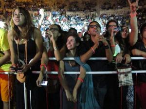 FILE - In this Friday, Sept. 14, 2012 photo, Arab fans of the Lebanese group Mashrou Leila' cheer as the band performs in the ancient Roman amphitheater in the Jordanian capital Amman. The popular Lebanese rock band says Jordanian authorities have banned it from performing again because its songs promote religious and sexual freedom. (AP Photo/Diaa Hadid, File)