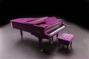 This undated photo released by Yamaha Entertainment Group shows a custom-made purple piano the company manufactured for musician Prince. Days before his death, Prince tweeted a photo of the piano intended to be a centerpiece of his scheduled tour. The acoustics of the piano were fine-tuned to Prince's specifications. The artist, 57, who was found dead in his suburban Minneapolis home Thursday, April 21, 2016, had intended it for his Prince, Piano and a Microphone tour. (Yamaha Entertainment Group via AP)