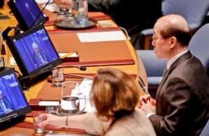 China's U.N. Ambassador and current Security Council president Liu Jieyi, right, listens as U.N. humanitarian chief Stephen O'Brien reports to the council in a live broadcast on the bombing of a hospital in Syria, Thursday April 28, 2016 at U.N. headquarters. (AP Photo/Bebeto Matthews)