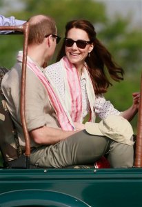 Britain's Prince William, left, along with Kate, the Duchess of Cambridge, prepare to set off on a jeep safari at Kaziranga National Park, northeastern Assam state, India Wednesday, April 13, 2016. Prince William and his wife, Kate, planned their visit to Kaziranga specifically to focus global attention on conservation. The 480-square-kilometer (185-square-mile) grassland park is home to the world's largest population of rare, one-horned rhinos as well as other endangered species including swamp deer and the Hoolock gibbon. (AP Photo/Anupam Nath)