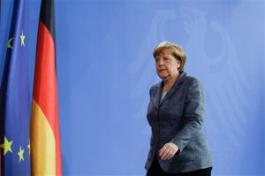 German Chancellor Angela Merkel leaves after a statement at the chancellery in Berlin, Friday, April 15, 2016. Chancellor Angela Merkel says the German government has granted a Turkish request to allow the possible prosecution of  German TV comedian Jan Boehmermann, who wrote a crude poem about Turkey's president. (AP Photo/Markus Schreiber)