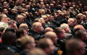 Local law enforcement and officers from across the country attend a memorial service for Virginia State Trooper Chad Dermyer at Liberty Baptist Church Tuesday, April 5, 2016, in Hampton, Va. Dermyer was killed in the line of duty at the Richmond Greyhound bus station last week. (Rob Ostermaier /The Daily Press via AP, Pool)