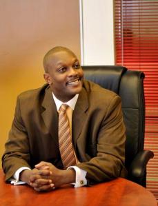 FILE- In this Oct. 2, 2010 file photo, Marcus Garvey Academy Principal James Hearn is seen in Detroit. Bankruptcies, tax liens and civil judgments are among the financial troubles that were faced by some Detroit principals accused of receiving kickbacks on inflated invoices for classroom supplies, in a school system crippled by debt and serving among the most under-privileged children in the country. (John T. Grelick/Detroit News via AP, File)  DETROIT FREE PRESS OUT; HUFFINGTON POST OUT; MANDATORY CREDIT