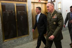 Defense Secretary Ash Carter, left, and Joint Chiefs Chairman Gen. Joseph Dunford walk in the Dirksen Senate Office building on Capitol Hill in Washington, Thursday, April 28, 2016, after testifying before the Senate Armed Services Committee hearing on the Islamic State group. (AP Photo/Evan Vucci)