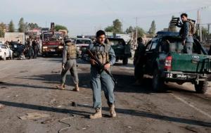 Afghan security forces inspect damage to a bus after a suicide attack in Jalalabad east of Kabul, Afghanistan, Monday, April 11, 2016. An Afghan official says that at least 12 new army recruits have been killed in a suicide bomb attack in the eastern city of Jalalabad, Ahsanullah Shinwari, the head of the Jalalabad hospital, said. (AP Photo/Mohammad Anwar Danishyar)