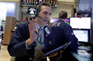 Trader Gregory Rowe works on the floor of the New York Stock Exchange, Wednesday, April 27, 2016. Stocks indexes are mostly lower in early trading as weakness in the technology sector pulls the broader market lower. (AP Photo/Richard Drew)