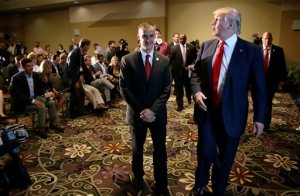 FILE - In this Aug. 25, 2015, file photo, Republican presidential candidate Donald Trump, right, walks with his campaign manager Corey Lewandowski after speaking at a news conference in Dubuque, Iowa. A Florida prosecutor's office plans to hold a news conference Thursday, April 14, 2016, amid reports that presidential candidate Donald Trump's campaign manager Lewandowski won't be prosecuted over a videotaped altercation with a female reporter. (AP Photo/Charlie Neibergall, File)