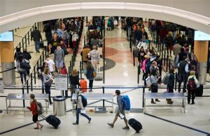 FILE - In this Nov. 25, 2015 file photo, travelers wait to go through a security checkpoint at HartsfieldJackson Atlanta International Airport in Atlanta. Republican leaders are lauding an aviation policy bill before the Senate as the most passenger friendly in years, but there are limits to friendship. (AP Photo/David Goldman, File)