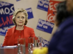 Democratic presidential candidate Hillary Clinton talks with local politicians and immigrant activists in New York, Wednesday, April 13, 2016. The meeting of immigrants and advocates was held, in part, to announce the New York Immigrant Action Fund's endorsement of Clinton. (AP Photo/Seth Wenig)