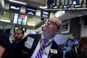 Trader David O'Day works on the floor of the New York Stock Exchange, Thursday, April 28, 2016. Stocks are opening broadly lower on Wall Street as traders look over the latest batch of earnings and deal news. (AP Photo/Richard Drew)