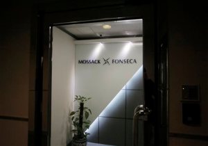 The Latest: Germany mulls national 'transparency register'  potted plant is placed at the entrance of the regional head office of Panama-based law firm Mossack Fonseca, one of the world's biggest creators of shell companies, in Hong Kong, Tuesday, April 5, 2016. China's Internet censors and state media outlets squelched reports Tuesday on hidden wealth drawn from documents leaked from a Panama-based law firm that name relatives of current and retired Chinese politicians, including President Xi Jinping. (AP Photo/Vincent Yu)