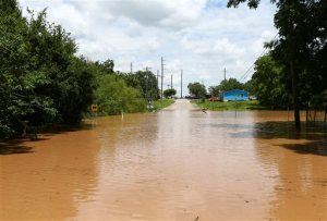 Sixth Street is impassible due to rising flood waters from the Brazos River Sunday, May 29, 2016, in Rosenberg, Texas. (Jon Shapley/Houston Chronicle via AP)