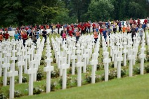 French and German youths take part in a show at the French National cemetery outside the Douaumont Ossuary, in Douaumont, northeastern France, Sunday May 29, 2016, during a remembrance ceremony to mark the centenary of the battle of Verdun. Hollande and Merkel are marking 100 years since the 10-month Battle of Verdun, which killed 163,000 French and 143,000 German soldiers and wounded hundreds of thousands. (Jean Christophe Verhaegen/Pool Photo via AP)