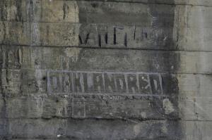 In this Monday, May 16, 2016 photo, some graffiti left by hobos are seen under the bridge in Los Angeles. The writings and drawings, some dating to 1914, were written with utensils like grease pencils or etched into the concrete under a 103-year-old bridge spanning the Los Angeles River. (AP Photo/Jae C. Hong)