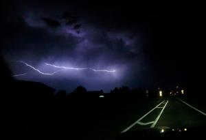 Lightning strikes cloud-to-cloud along a county road near Lawrence, Kan., Thursday, May 26, 2016. Severe storms that produced at least one tornado moved through the area overnight. (AP Photo/Orlin Wagner)