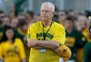 FILE- In the Sept. 12, 2015 file photo, Baylor President Ken Starr waits to run onto the field before an NCAA college football game in Waco, Texas. Baylor University officials say regents are still reviewing an investigation into how the Texas school handled reports of rape and assault by football players and expect to announce any actions by June 3, 2016. Baylor issued the statement Tuesday, May 24, 2016, after reports that President Ken Starr was fired. The school said it would not respond to "rumors." (AP Photo/LM Otero, File)
