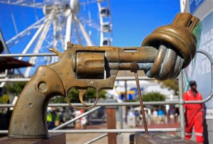 FILE - In this Tuesday, Feb. 26, 2013 file photo, a sculpture by Carl Fredrik Reutersward, titled "knotted gun" which is a symbol designed to protest against global violence and senseless killings, is displayed in Cape Town, South Africa. Carl Fredrik Reutersward, one of Swedens best-known modern artists and the creator of the iconic statue of a revolver barrel tied in a knot, has died. He was 81. Thomas Millroth, from the Carl Fredrik Reutersward Art Foundation, said the artist died in a hospital in Helsingborg, southwestern Sweden on Tuesday, May 3, 2016. No cause of death was given.(AP Photo/Schalk van Zuydam, file)