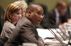 Mike Williams, athletic director for the University of California, Berkeley, discusses a proposal to expand financial aid to student athletes in the event of a career-ending sports injury, during a meeting of the University of California governing board Wednesday, May 11, 2016, in Sacramento, Calif. Williams and Teresa Gould, left, interim athletic director for UC Davis, were part of a working group tasked with making recommendations for improving the well-being of participants in intercollegiate sports. The board approved the plan to greatly expand the number of student-athletes guaranteed financial aid to complete their studies if they have a career-ending injury. The proposal is set to go to the full board on Thursday. (AP Photo/Rich Pedroncelli)