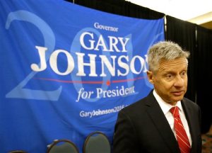 FILE - In a Friday, May 27, 2016 file photo, Libertarian presidential candidate Gary Johnson speaks to supporters and delegates at the National Libertarian Party Convention, in Orlando, Fla. Omn Sunday, May 29, 2016, The Libertarian Party again nominated former New Mexico Gov. Johnson as its presidential candidate, believing he can challenge presumptive Republican nominee Donald Trump and Democratic front-runner Hillary Clinton because of their poor showing in popularity polls.  (AP Photo/John Raoux, File)