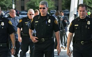 San Antonio Police Chief  William McManus walks away with members of his staff on Tuesday, May 3, 2016, after addressing the media concerning SAPD officer, Juan Ruiz-Carrillo in San Antonio, Texas.  Authorities say Ruiz-Carrillo, a five-year veteran of the San Antonio Police Department is suspected of sexually assaulting a girl on a nearly weekly basis for about four years.  He was arrested Monday, May 2, 2016, and charged with sexually assaulting a child. (Bob Owen/The San Antonio Express-News via AP) RUMBO DE SAN ANTONIO OUT; NO SALES; MANDATORY CREDIT