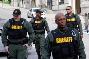 Members of the Baltimore City Sheriff's Office walk outside a courthouse before a verdict in the trial of Officer Edward Nero, one of six Baltimore city police officers charged in connection to the death of Freddie Gray, in Baltimore, Monday, May 23, 2016. (AP Photo/Patrick Semansky)