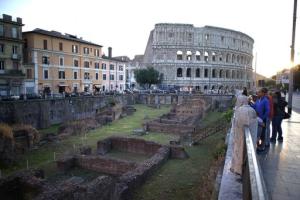 Tourists admire the Ludus Magnus ancient Roman archeological site, in Rome, Tuesday, May 24, 2016. Ludus Magnus, a site of what was the main training school for gladiators, just up the road from the Colosseum, is among the monuments that Rome is offering in a form of "adoption" with a project called "100 proposals for patrons", seeking all the sponsors it can find to fund the monumental job of restoring and maintaining its hundreds of fountains, statues, archaeological sites and historic palazzos. (AP Photo/Andrew Medichini)