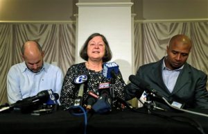 FILE - In this April 9, 2013, file photo, former NFL player Dorsey Levens, right, extends a hand as Mary Ann Easterling, the widow of former NFL player Ray Easterling, reacts as former NFL player Kevin Turner, left, looks down during a news conference in Philadelphia, after a hearing to determine whether the NFL faces years of litigation over concussion-related brain injuries. A federal appeals court has upheld an estimated $1 billion plan by the NFL to settle thousands of concussion lawsuits filed by former players, potentially ending a troubled chapter in league history. The decision released Monday, April 18, 2016, comes nearly a year after a district judge approved a revised deal that lifted the initial $765 million cap and weeks after an NFL official speaking to Congress acknowledged for the first time a link between football and CTE. (AP Photo/Matt Rourke, File)