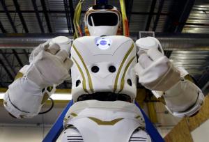 In this May 2, 2016 photo, a six-foot-tall, 300-pound Valkyrie robot is seen at University of Massachusetts-Lowell's robotics center in Lowell, Mass. "Val," one of four sister robots built by NASA, could be the vanguard for the colonization of Mars by helping to set up a habitat for future human explorers. But first theyre finding new homes on Earth and engineers to hone their skills. (AP Photo/Elise Amendola)