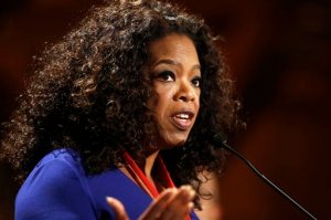FILE - In this Tuesday, Sept. 30, 2014, file photo, Oprah Winfrey addresses an audience after accepting the W.E.B. Du Bois medal during ceremonies, on the campus of Harvard University, in Cambridge, Mass. Winfrey unveiled the first episode of her new series Greenleaf Wednesday, May 25, 2016 at a private screening at Soho House in West Hollywood, Calif. The show, which follows the personal dramas and questionable ethics of a family at the center of a Memphis mega-church, is set to premiere next month on Winfreys namesake network. (AP Photo/Steven Senne, File)