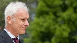 Volkswagen AG, CEO, Matthias Mueller,  arrives for a press  conference at the company's headquarters in Wolfsburg, Germany, Thursday June 16, 2016. German automaker Volkswagen plans to intensify its push into electric vehicles as it fights to bounce back from a scandal over diesel cars rigged to cheat on emissions tests. CEO Matthias Mueller said Thursday the company plans to introduce more than 30 electric-powered vehicles by 2025, and to sell 2 to 3 million of them a year. ( Julian Stratenschulte/dpa  via AP)