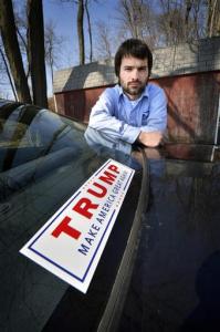 FILE - In this March 6, 2016 photo, Tomas Strouhal shows the Trump sticker that is on his car outside his home near Quarryville, Pa. Almost everyone has opinion about this year's topsy-turvy presidential race, but if you're one of nearly 3 million federal workers, be careful what you say and do. (Richard Hertzler/Lancaster New Era via AP)