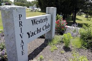 In this Monday, June 20, 2016 photo, a granite sign outside the Westerly Yacht Club is seen in Westerly, R.I. Wives can join the club as associate, non-voting members, but unmarried women can't. A vote to change the nearly century-old policy failed last week, with 171 men voting to uphold it. Women, and many men, are not happy. (AP Photo/Elise Amendola)