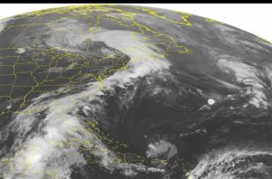 This NOAA satellite image taken Monday, June 6, 2016 at 12:45 a.m. EDT shows Tropical Storm Colin continuing to move due north over eastern portions of the Gulf of Mexico. Some of the outer rain bands have also begun moving over the western Florida shoreline as the tropical storm continues to move northward. An extended area of clouds is observed stretching from a low pressure system over southern Quebec over much of the eastern seaboard and connecting to Colin. Much of the central United States remains cloud-free with high pressure dominating. (NOAA/Weather Underground via AP)