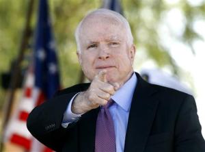 Sen. John McCain, R-Ariz, acknowledges a fellow Navy veteran during a Phoenix Memorial Day Ceremony at the National Memorial Cemetery of Arizona, Monday, May 30, 2016, in Phoenix. At age 79, running what may be his last campaign, McCain finds himself on uncertain terrain. (AP Photo/Ralph Freso)